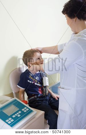 Medical Otitus Examination Of A Child At A Ear Nose Throat Doctor