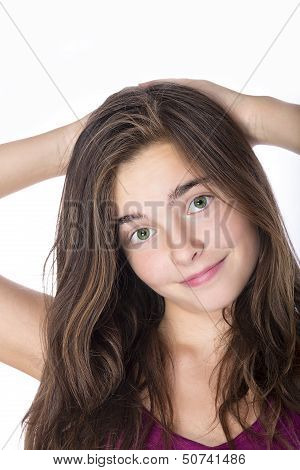 Portrait Of A Teenage Girl Hands Behind Here Head Isolated On White