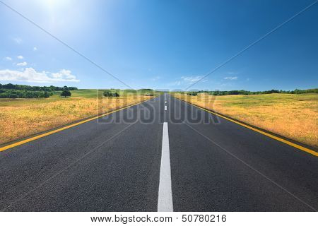 Driving On An Empty Road At Bright Sunny Day