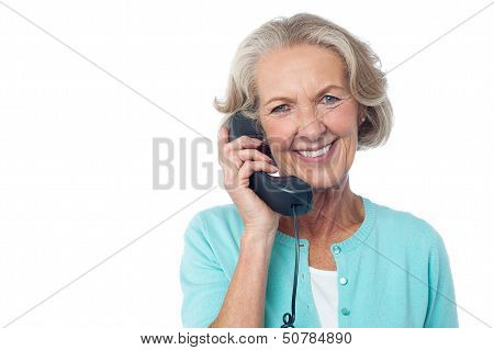 Senior Lady Holding Phone Receiver