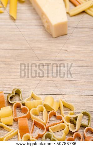 Pasta With Heart Shape On A Wooden Board