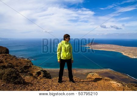 tourist woman on the top of rock