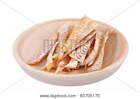 Slices Of Dried Fish On Wooden Plate Isolated Over White.