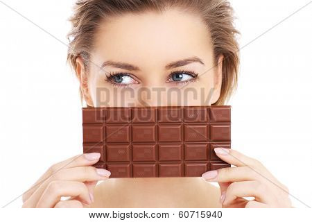 A picture of a pretty woman holding chocolate over white background