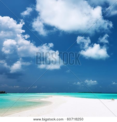 Beautiful island beach with sandspit at Maldives