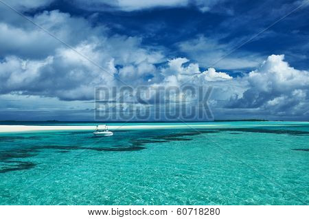 Beautiful island beach with sandspit at Maldives