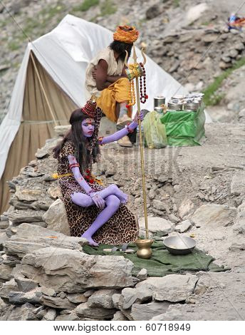 AMARNATH, JAMMU AND KASHMIR, INDIA - JULY 18, 2006: Young sadhu monk symbolizes Shiva god on the way to holy Amarnath cave in Himalayas. 