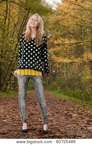 Blond Smiling Teen In The Autumn