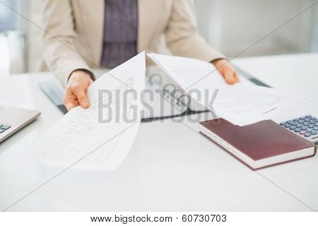 Closeup On Clueless Business Woman With Documents