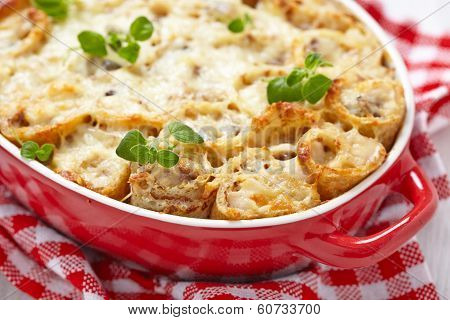 Baked crepes roll with chicken and cheese