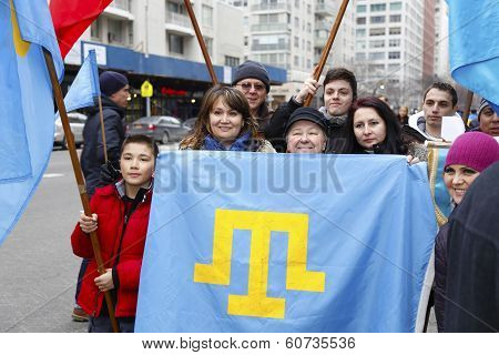 Family holding Crimean Flag