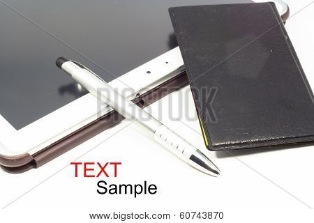 Empty tablet and notebook with a pen isolated