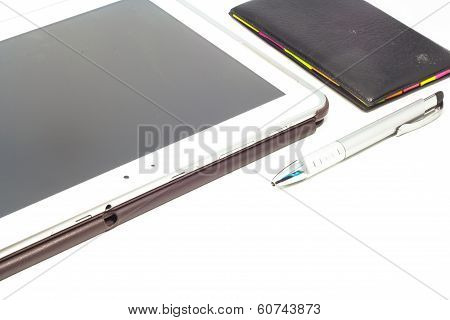 Empty tablet and notebook with a pen isolated