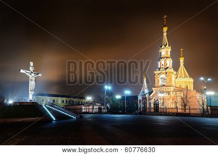 Statue Of The Crucifixion And Church.
