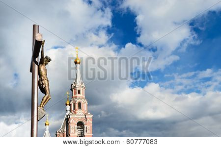 Statue Of The Crucifixion And Church.