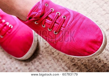 Closeup Of Casual Vibrant Pink Sneakers Shoes Boots On Female Feet