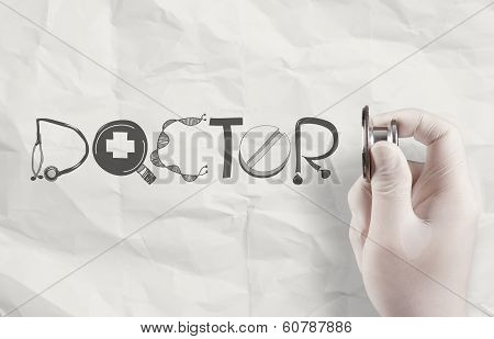 Hand Hold Stethoscope Showing Docter Design Word  On Crumpled Paper Background
