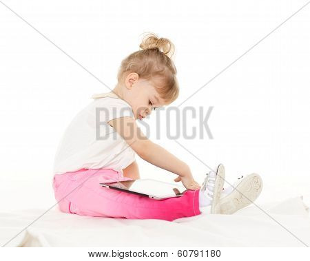 Small Girl With Computer Tablet.