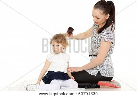 Mum Looks After Hair Of The Child..