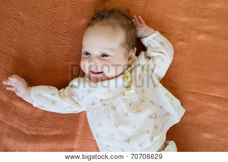 Baby Girl In A Brown Elegant Blouse