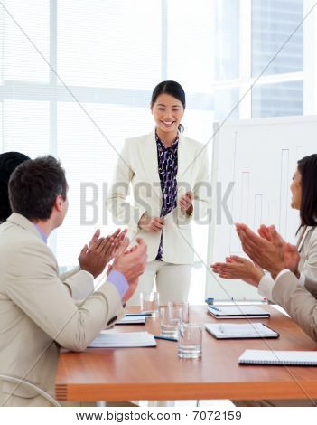 Successful Asian Woman Giving A Presentation