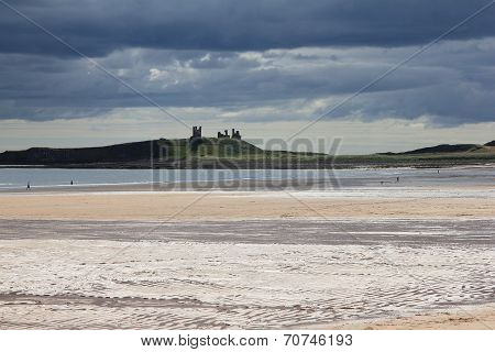 Dunstanburgh Castle With Stormy Skies