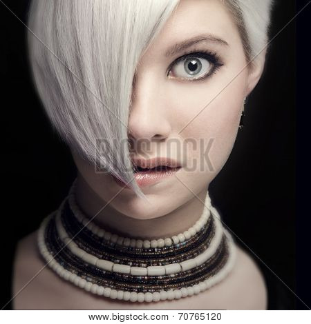 Beautiful young woman bites her lip