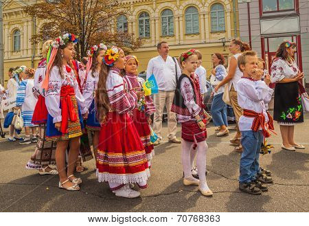 Children-twins In The National Traditional Costumes Of Their Regions In The Parade Of Embroidery