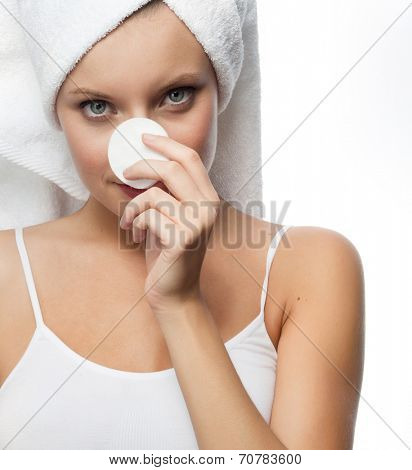closeup portrait of attractive  caucasian smiling woman blond isolated on white studio shot lips toothy smile face towel tube head and shoulders looking at camera cotton disc clesning face