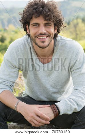 Portrait Of Smiling Young Man Outside