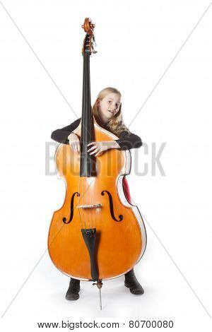 Young Girl Holds Double Bass In Studio