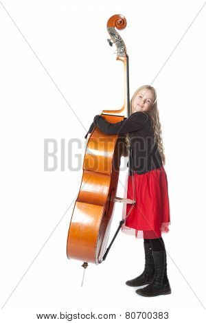 Young Girl Embraces Double Bass In Studio
