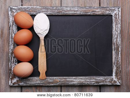 Blackboard menu blank on rustic wooden planks background