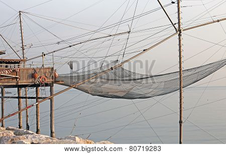 Fishing Nets Over The Stilt Houses Of Wood