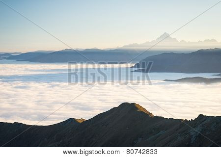 Misty Mountainscape At Sunset