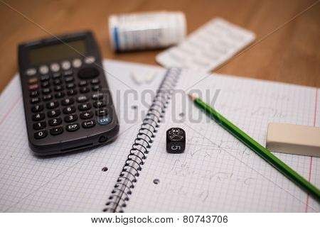 Study Place With Calculator And Painkillers In Background
