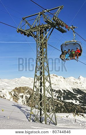 Father And Tree Kids On Ski In The Cable Car Cabin