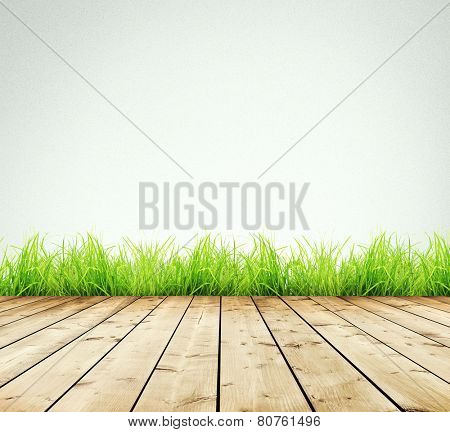 Wooden planks with green grass on white background 