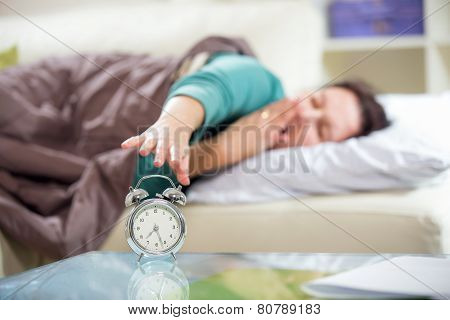 Woman's hand off the alarm clock.
