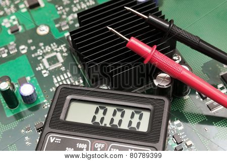 Close-up Multimeter On Pcb Plate.