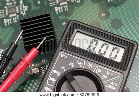 Close-up Multimeter On Pcb Plate.