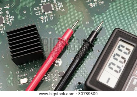 Close-up Multimeter On Pcb Plate.