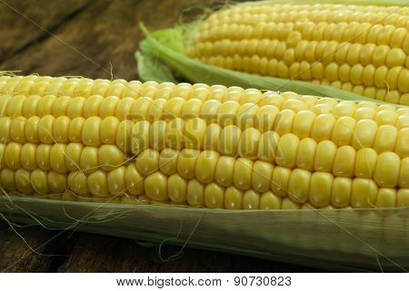 Large, Mature, Young Corn On The Wooden Background