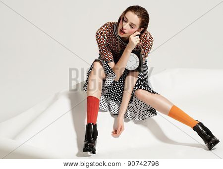 Fashion model pose on light background