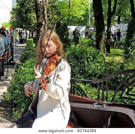 The Girl Playing The Violin For Free In The City Square