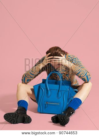 Fashion model pose on light background