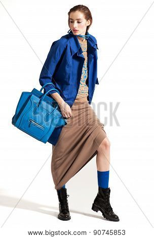 Fashion model pose on light background