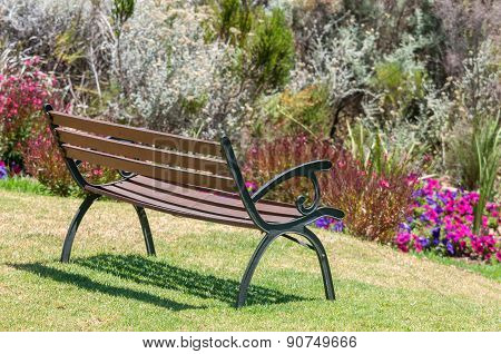 Rustic Bench Between Flowers
