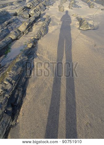 Human Shadow Cast Upon Beach