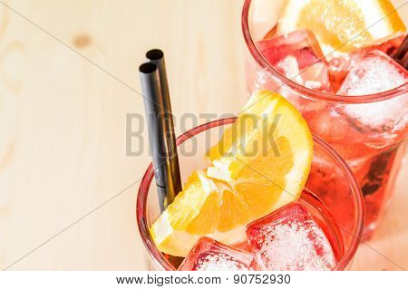 Close-up Of Glass Of Spritz Aperitif Aperol Cocktail With Orange Slices And Ice Cubes